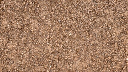 Brown small stone floor texture background. Rural roads or pavements are used for travel. Close-up...