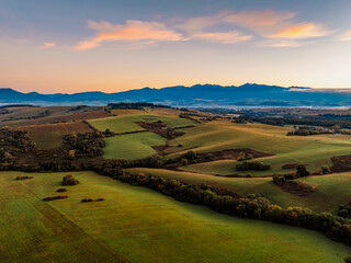 Sunset over Liptov region with and High Tatras mountains around. Liptovsky Mikulas landscape, slovakia.