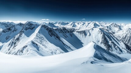 Obraz premium Snowy mountain peaks panorama. Vast expanse of pristine white snow-covered peaks under a vibrant blue sky. Sunlight highlights the rugged terrain