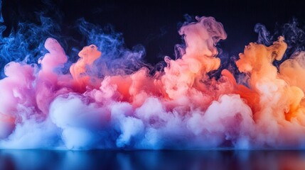 Vibrant smoke fills the air with swirling colors of pink, blue, and orange during a creative visual display at a studio event in the evening