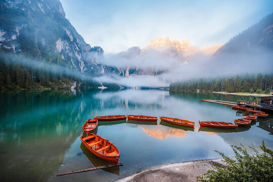 Lago di Braies or Pragser Wildsee lake with boats and fishing dock.Fanes-Sennes-Braies national park in Dolomiti Alps, South Tyrol, Italy
