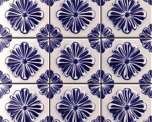 This close-up image showcases beautifully crafted blue and white tiles featuring intricate floral patterns, perfect for adding a touch of elegance to any interior design or archite