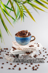 Fresh coffee beans in a mug and background.