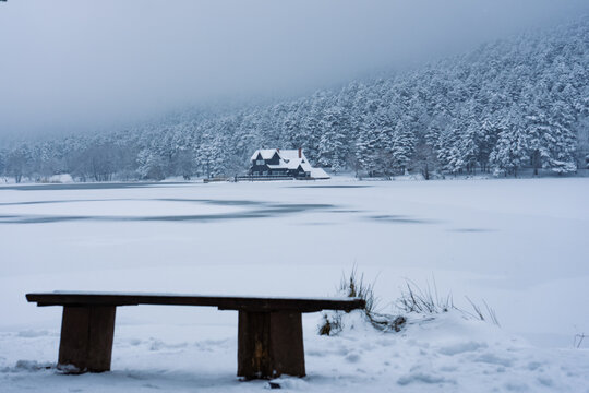 Bolu Golcuk National Park, lake wooden house on a snowy winter day in the forest in Turkey