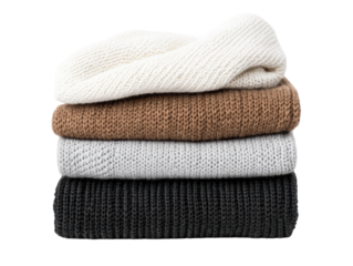Cozy knitted sweaters stacked in warm colors for fall fashion, cut out