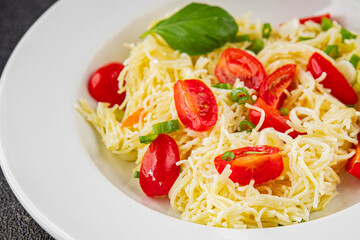 Pasta with tomatoes vermicelli vegetables dish fresh delicious gourmet food background on the table rustic food top view copy space