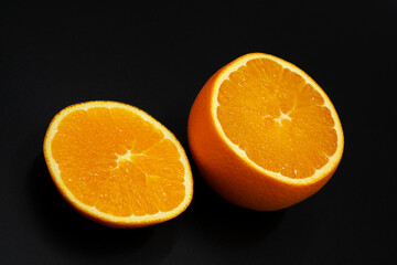 Large orange in section. Citrus. Half of an orange.