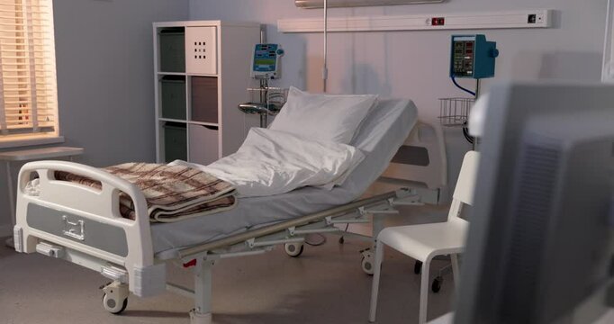 A modern hospital room with a comfortable bed and essential medical equipment for care