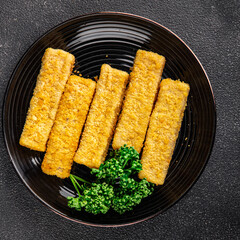 Fish sticks seafood dish fresh gourmet food background on table rustic food top view copy space