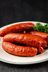 Sausages smoked pork meat beef dish fresh gourmet food background on table rustic food top view copy space