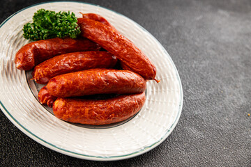 Sausages smoked pork meat beef dish fresh gourmet food background on table rustic food top view copy space