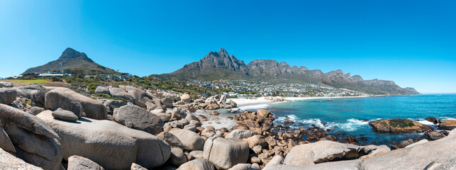 Cape Town, South Africa with Table mountain, Lions Head, Camps Bay and the 12 Apostles - Breathtaking travel panorama with clear blue sky
