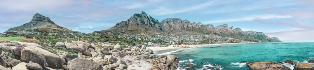 Cape Town, South Africa with Table mountain, Camps Bay and the 12 Apostles - Breathtaking travel panorama with misty sky