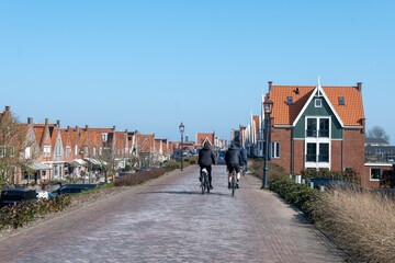 Tourists destination in North Holland, old authentic fishermen village Volendam near Amsterdam with old houses and narrow streets