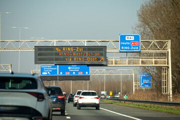 Road network infractrusture in Netherlands, driving safe on high quality asphalt on Dutch highways, A2, traffic jam problems, road construstion, many cars, rush hours