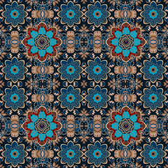 Flowers among dry grass. Autumn design for tablecloth, carpet, scarf, tapestry in fairytale ethnic style. Red and blue mandalas flowers and plant ornament on black background. Seamless pattern.
