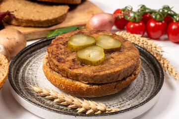 Make burger buns with vegan or vegetarian patties or burgers made from grains, vital wheat gluten food, grilled healthy food