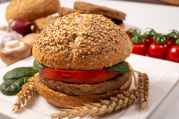 Make burger buns with vegan or vegetarian patties or burgers made from grains, vital wheat gluten food, grilled healthy food