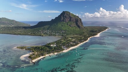 Obraz premium Aerial view of Le Morne Peninsula and sea lagoon formed by coral reefs, Mauritius Island, Africa, Indian Ocean 