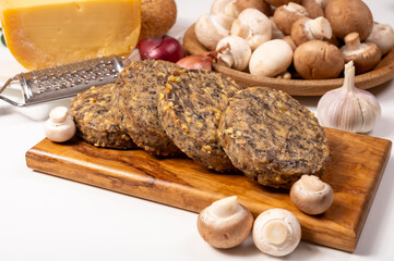 Tasty organic vegetarian food, burgers with champignons mushrooms, cheese and onion