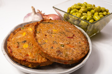 Round vegetarian patties or burgers made from grains, soybeans, vegetables and legumes