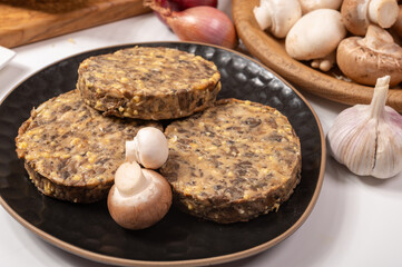 Tasty organic vegetarian food, burgers with champignons mushrooms, cheese and onion
