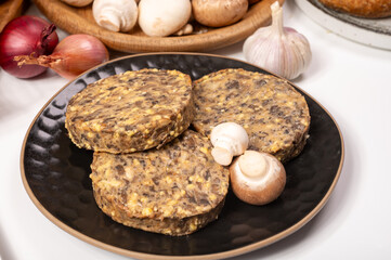 Tasty organic vegetarian food, burgers with champignons mushrooms, cheese and onion