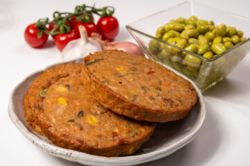 Round vegetarian patties or burgers made from grains, soybeans, vegetables and legumes