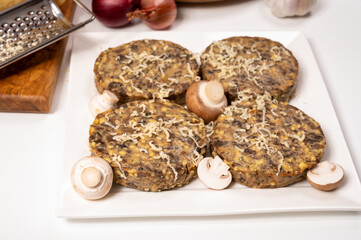 Tasty organic vegetarian food, burgers with champignons mushrooms, cheese and onion