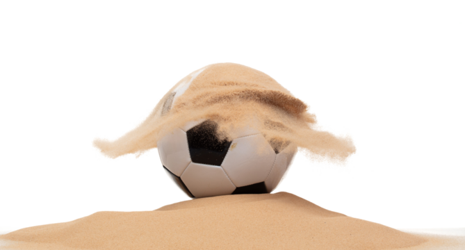 Classic sport football ball on sand pile over white background isolated. Sand splashing splatter by hitting soccer football ball attack and sand explode explosion.