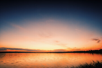 Serene sunset over a calm lake