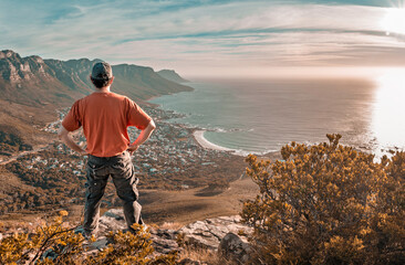 Top of the world - Victory and success. Cape Town hiker reaches summit of Lions Head, Table Mountain. South Africa is best travel and tourism destination for adventure and nature