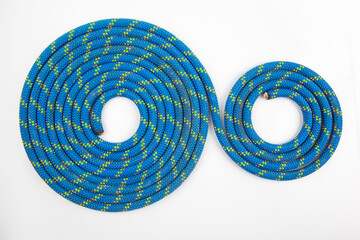 durable colored rope for climbing equipment. knot of braided cable. item for tourism and travel