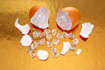 Surreal orange egg broken to expose dazzling crystals, with shell fragments on a shiny gold...