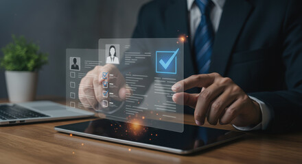 Streamlining HR: Businessman reviews candidate profiles on digital tablet, selection, talent acquisition, hiring process, modern recruitment.