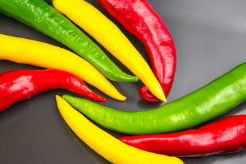 yellow, red and green hot chili on a plate. Pepper. Vegetable vitamin food.