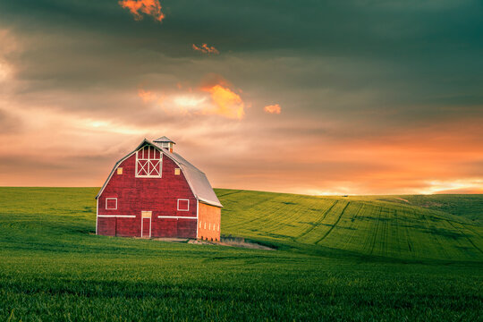 Red barn in the Palouse at sunrise