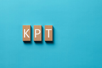 There is wood block with the word KPT. It is an abbreviation for Keep, Problem, Try as eye-catching...