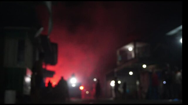 New Year's Eve celebration with fireworks and smoke bombs, and red collors