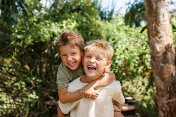 Fototapeta premium Boys playing outside the house 