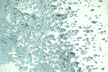 Many water bubbles on light background, closeup