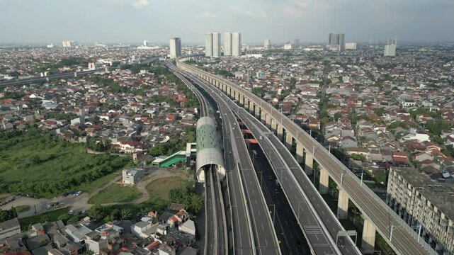 Aerial view of highway intersection and train lines