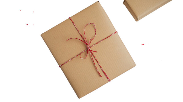 a brown package with a red string tied to it