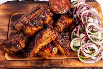 Savoring grilled meat with fresh salad on a wooden platter