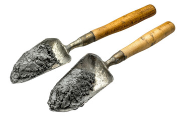 Two vintage scoops filled with dark gray powder on black background isolated on transparent background