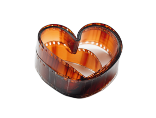 Heart shaped from camera film strip curled into position on white background