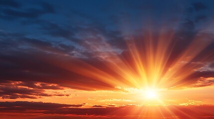 Fototapeta premium Stunning sunset with radiant sunbeams piercing clouds. Fiery skies in vibrant hues of orange, red, and deep blue