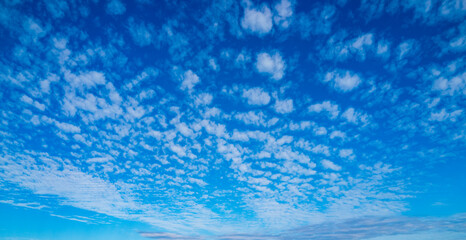 White clouds on blue sky. Beautiful sunny sky. Background with clouds on blue sky. Clouds on sky design.