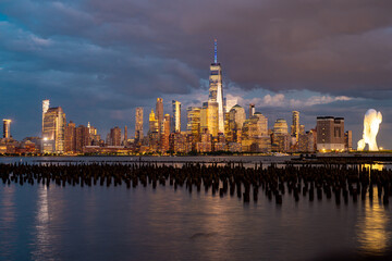 Obraz premium New York City. NYC skyline with towering skyscrapers. Manhattan and Hudson River. Panoramic cityscape of New York. Downtown NYC with landmarks. New York skyline. New York building.