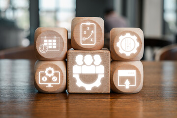 Wooden blocks with digital icons symbolize release management, showcasing software development and project planning concepts.